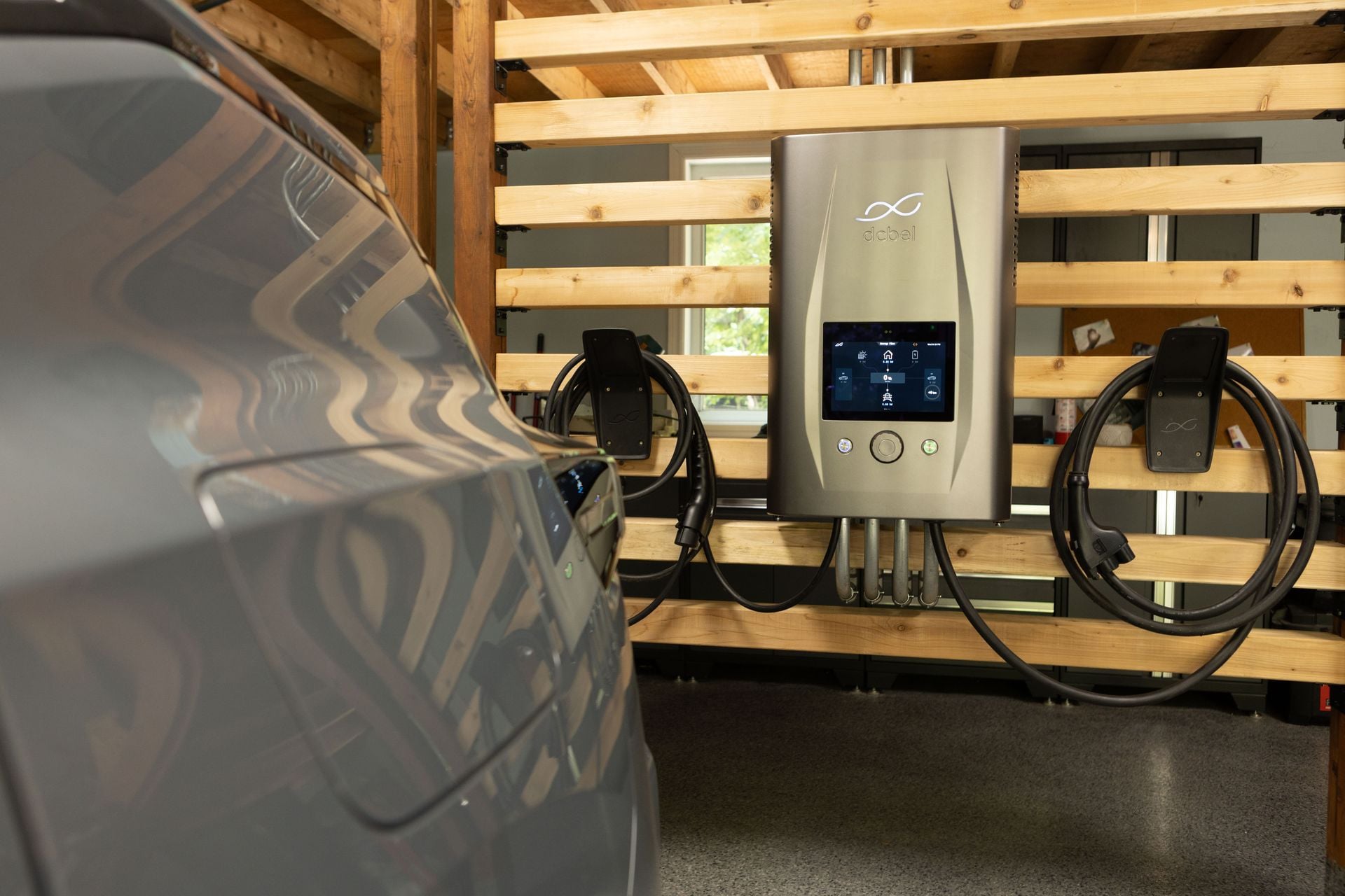 Ara Home Energy Station in a garage near an EV